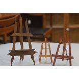 A group of three treen easels including a Bavarian style easel (tallest 29cm), £20-40