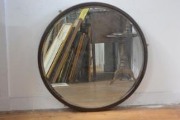 A 1930s walnut circular framed wall mirror with bevelled glass plate (81cm), £30-40