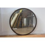 A 1930s walnut circular framed wall mirror with bevelled glass plate (81cm), £30-40