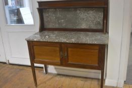 An Edwardian mahogany inlaid marble inset panel ledgeback and top washstand fitted two panel doors,