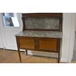 An Edwardian mahogany inlaid marble inset panel ledgeback and top washstand fitted two panel doors,
