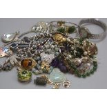 A collection of costume jewellery including jadeite bead necklaces, jadeite buddha style pendant, en