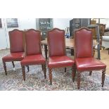A set of four 19thc mahogany framed upholstered and brass studded panel back side chairs with stuffo