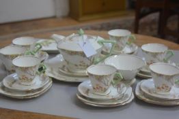 An Art Deco Royal Standard willow tree and floral pattern polychrome enamel decorated teaset of twen