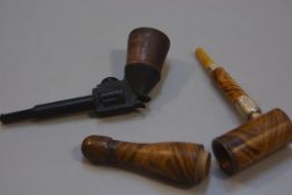 A 19thc treen novelty metamorphic bottle pipe with amberoid mouthpiece and a novelty treen bakelite