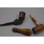 A 19thc treen novelty metamorphic bottle pipe with amberoid mouthpiece and a novelty treen bakelite