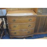 A mahogany reproduction bow front chest, the top with fluted edge above three long drawers, raised o