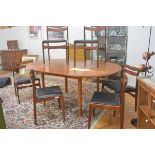A G Plan 1970s teak seven piece dining suite comprising a circular top extending dining table with m