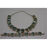 An artisan made white metal necklace mounted fifteen green nephrite panels (59cm, central panel 2cm