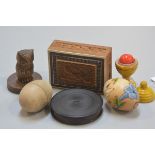 A treen carved miniature owl, a sandalwood Eastern carved box, a treen Indian yellow ball puzzle, an