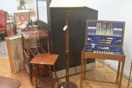 A mahogany turned wood floor lamp and shade, on circular moulded base (h.142cm), £10-20