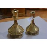 Two Middle Eastern brass panelled lamp bases with bird and stylised flower decoration (h.28cm and h.