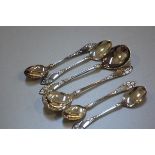 A Norwegian 830 standard 2H.Marthinsen set of four teaspoons and pair of jam spoons, with floral lea