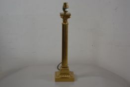 A reproduction brass fluted Corinthian column table lamp, raised on moulded square base (h.39cm), £2