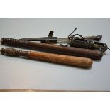 A hardwood truncheon with pierced ringed handle and a treen carved truncheon, a deer hoof handled kn