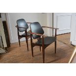 A stylish pair of Swedish teak bentwood open arm carver chairs with black vinyl upholstered panel ba