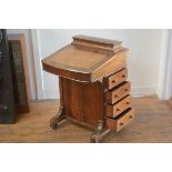 A Victorian figured walnut davenport inlaid desk, with lift up box top and slope front, enclosing a