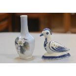 A Copenhagen porcelain bud vase decorated with blackberry design and a Portugese Viana Costelo bird