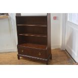 A Stag Mistral mahogany upright waterfall bookcase fitted two adjustable shelves and single drawer,