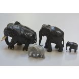 A group of three African 1920s carved ebony elephants and a carved soapstone elephant figure (4) (ta