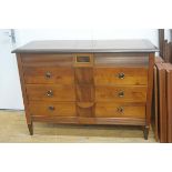 A cherrywood and mahogany Colonial commode, the rectangular top with moulded edge and crossbanded bo