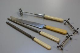 A collection of carving tools including joint holder, carving knife, two steels and a pair of Epns