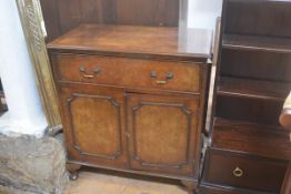 A figured walnut chest, the rectangular top with crossbanded border and moulded edge, above a single