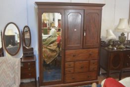 A 19thc mahogany gentleman's wardrobe, the moulded cornice above a pair of short inset panel doors,