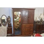 A 19thc mahogany gentleman's wardrobe, the moulded cornice above a pair of short inset panel doors,