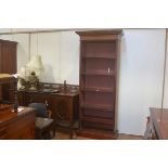 A Colonial teak upright open bookcase, the moulded cornice above an arrangement of five adjustable s