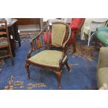 An Edwardian mahogany and beech inlaid panel back tub chair, with inset seat, raised on turned taper