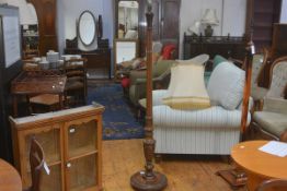 A 1920s mahogany fluted column acanthus leaf carved floor lamp, raised on circular moulded base with