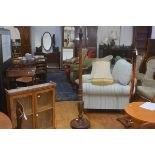 A 1920s mahogany fluted column acanthus leaf carved floor lamp, raised on circular moulded base with