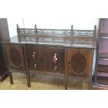 A late 19thc Chippendale style ledgeback sideboard with pierced gallery back, mounted with finials