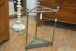 An Edwardian brass triangular shaped six division stick/umbrella stand, complete with original ename