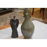 Carolina Valvona, a baluster vase with Aztec style mask top and a terracotta angel figure (2), £20-4