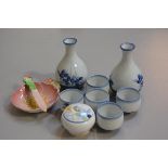 A Japanese seven piece blue and white underglaze sake set, a Grafton china 1930s mustard and a Carlt