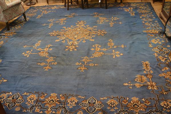 A 1900/1920s Turkey carpet, the centre medallion with radiating lotus flower and leaves, enclosed wi