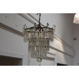 A 19thc three tier crystal faceted waterfall pendant light fitting with crystal faceted ball and dro