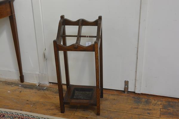 A 1920s oak four division stick stand on square supports, complete with drip tray (h.78cm), £20-30