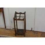 A 1920s oak four division stick stand on square supports, complete with drip tray (h.78cm), £20-30