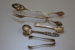 Two Norwegian 830 standard cake lifts, a pair of pierced 830 standard sugar tongs, jam spoon, and an