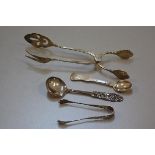 Two Norwegian 830 standard cake lifts, a pair of pierced 830 standard sugar tongs, jam spoon, and an