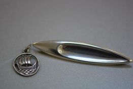 A Hans Jensen Danish silver shield style sterling silver brooch (l 7cm) and a Viking Longboat style