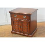 A cherrywood Colonial style bedside, the rectangular top with moulded edge above a single frieze dra