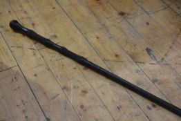 An African carved ebonised walking stick with pommel handle (l. 100cm), £20-40