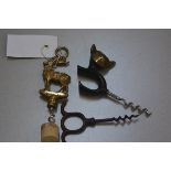 A novelty cat bronze corkscrew, an Inverness cast brass stag corkscrew and a metal corkscrew (3), £2