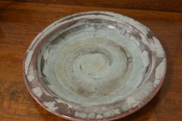 A modern pottery fossil stone fruit dish, signed with impressed mark verso (d. 31cm), £10-20