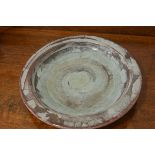 A modern pottery fossil stone fruit dish, signed with impressed mark verso (d. 31cm), £10-20