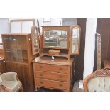 An Edwardian walnut dressing chest with triple adjustable mirror, with centre jewel drawer, above th